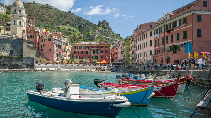 Boats in front of a coastal Italian town